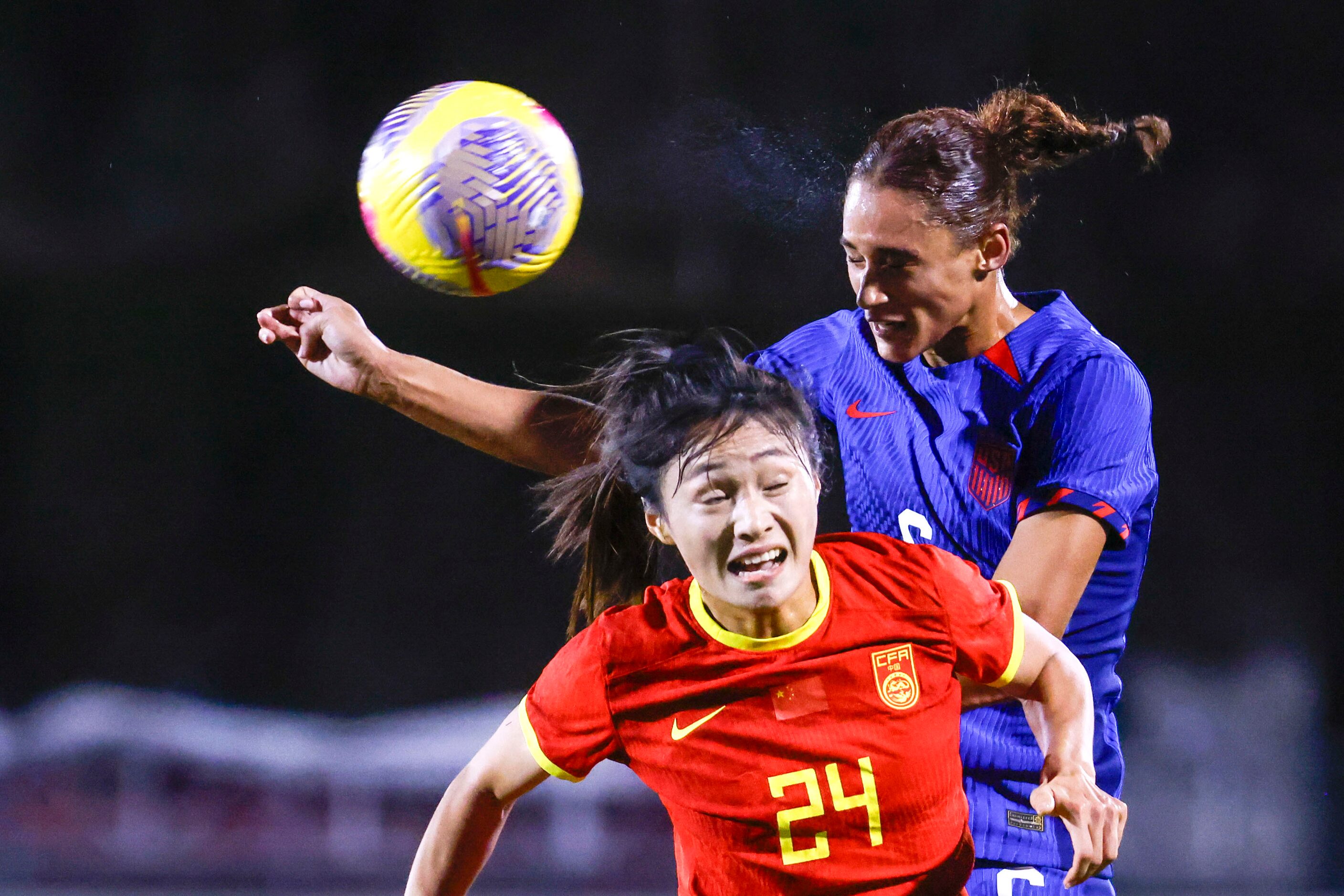 China’s Jin Kun (front) attempts to win a head against United State’s Lynn Williams during...