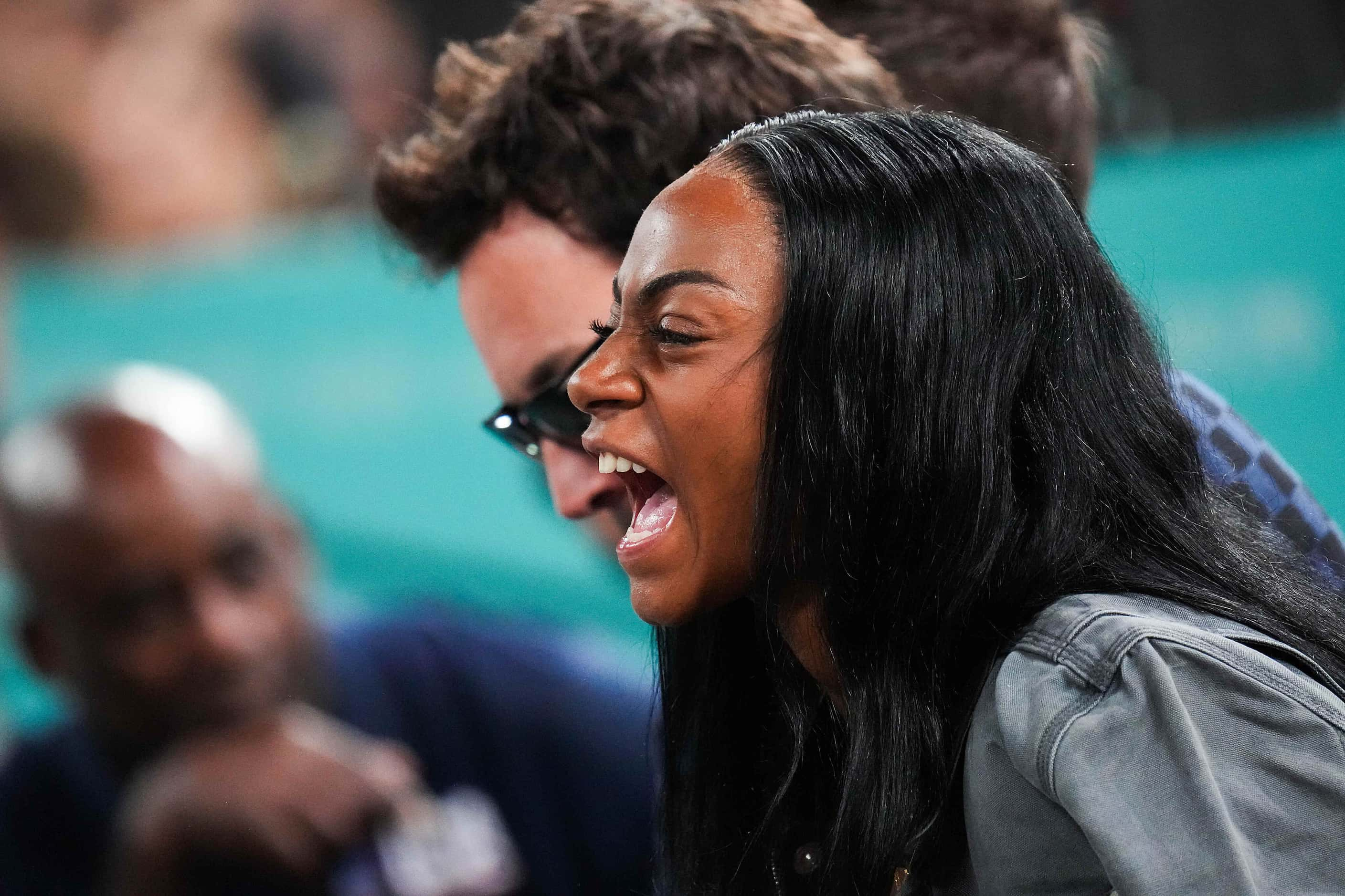 Sha’carri Richardson cheers from courtside with Jimmy Fallon during the men's gold medal...