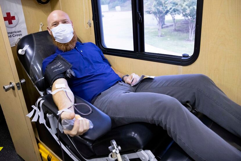 Jeff Langlitz, principal-aftermarket sales, donates blood on Aug. 26 at the McMillan James...