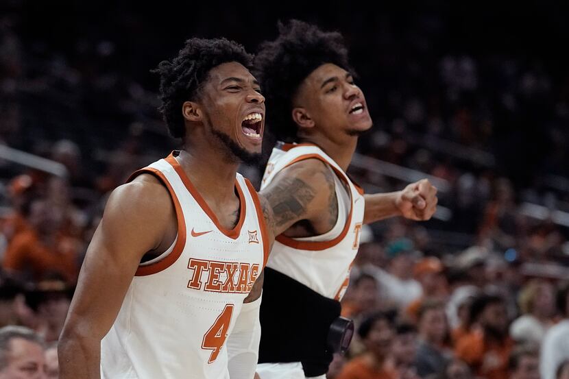 Texas guard Tyrese Hunter (4) and Texas forward Dillon Mitchell, right, celebrate a score...
