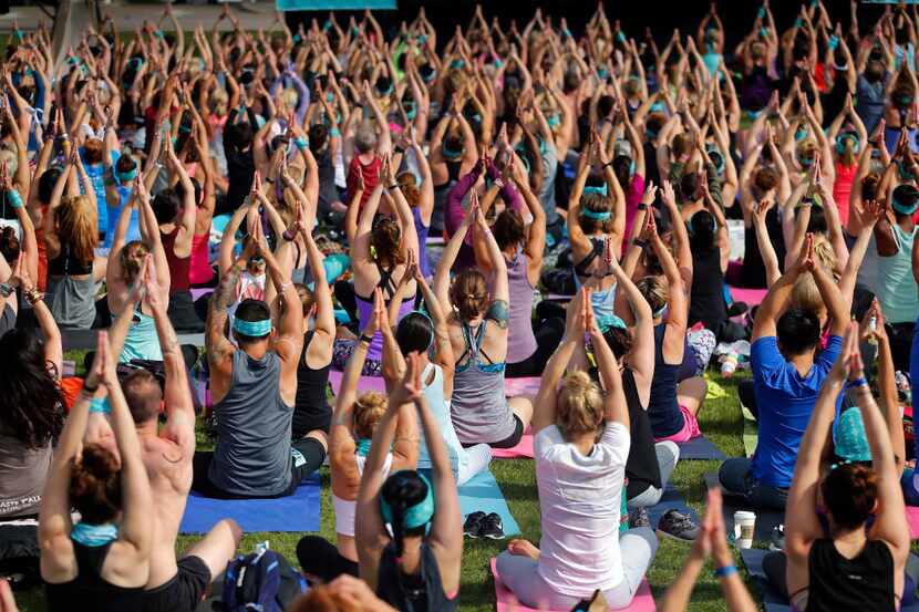 Yoga enthusiasts participate in a yoga and mediation session following in downtown Dallas. 