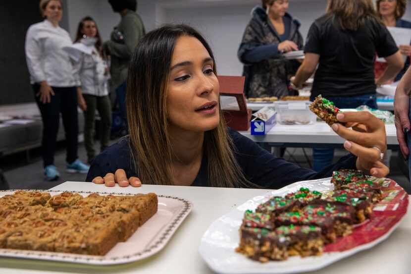 Judge Soraya Spencer, owner and chef at Gather Kitchen, examines some cookie bars during the...