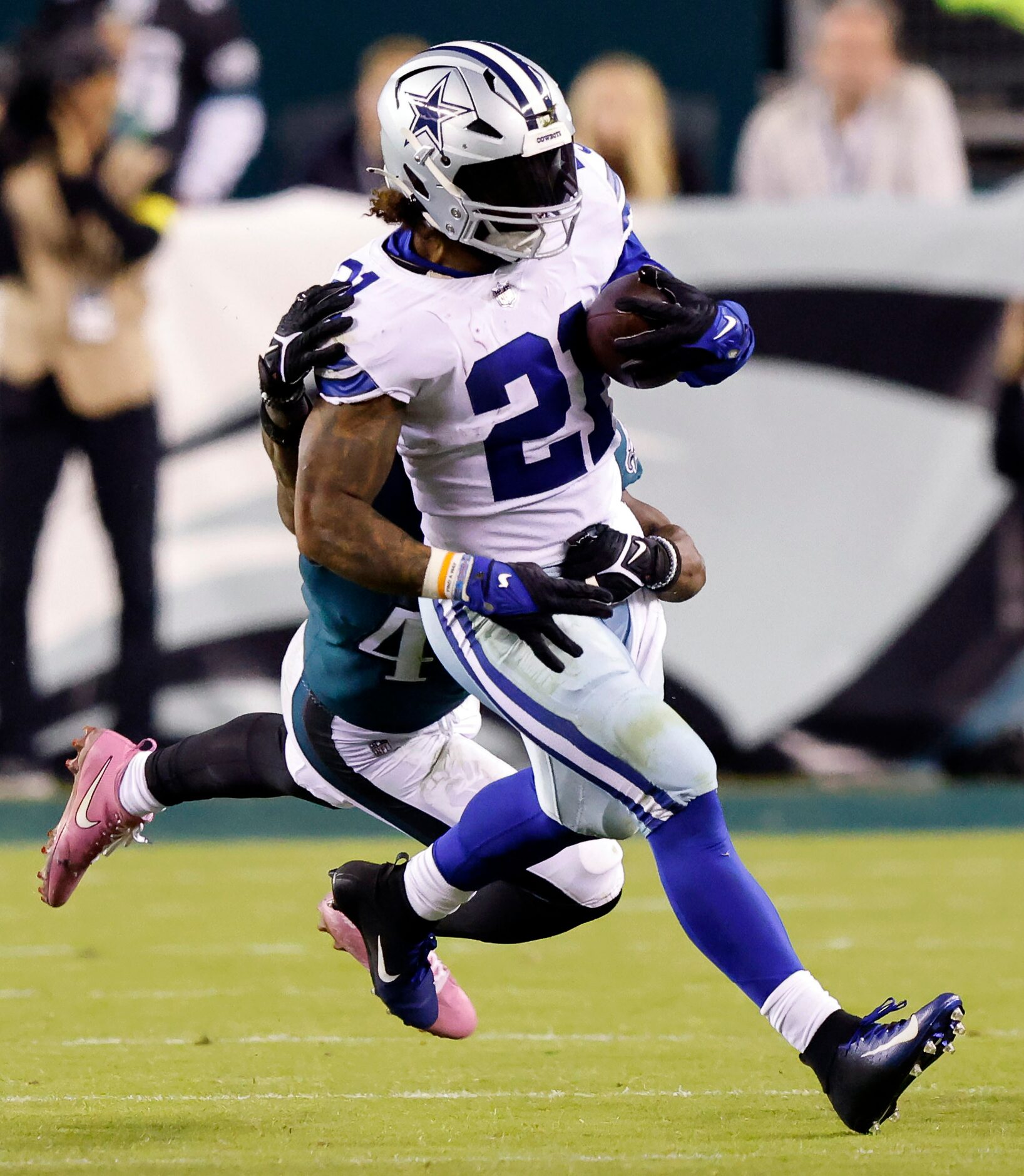 Philadelphia Eagles safety K'Von Wallace (42) drags down Dallas Cowboys running back Ezekiel...