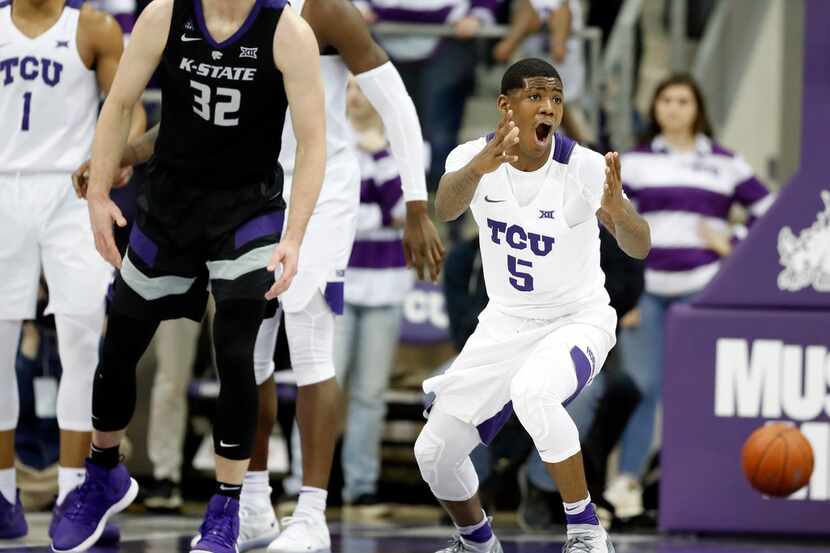 TCU's Desmond Bane (1) and Kendric Davis (5) look to the sideline after Davis was charged...