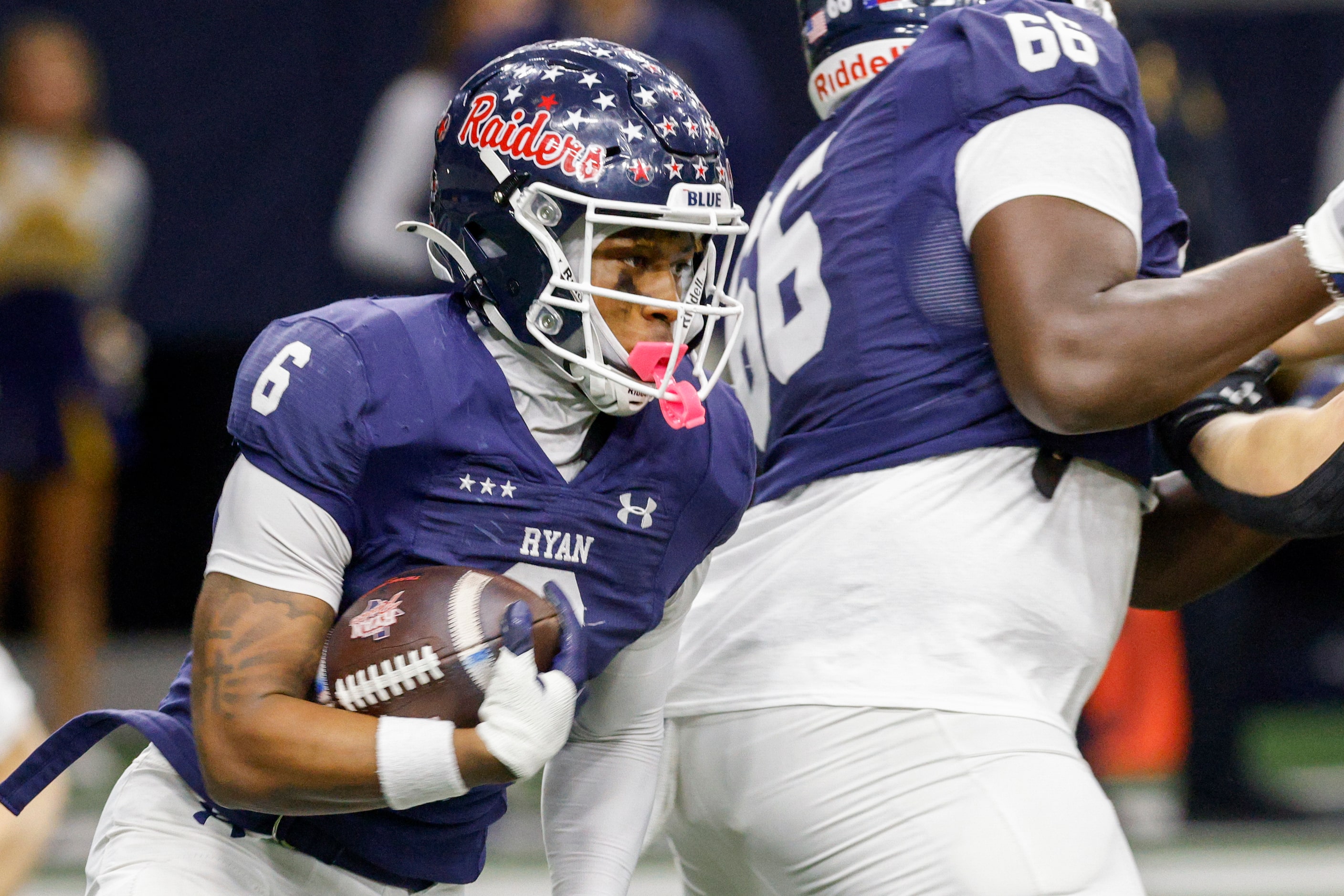 Denton Ryan running back Nemo Warmate (6) runs the ball during the first half of a Class 5A...