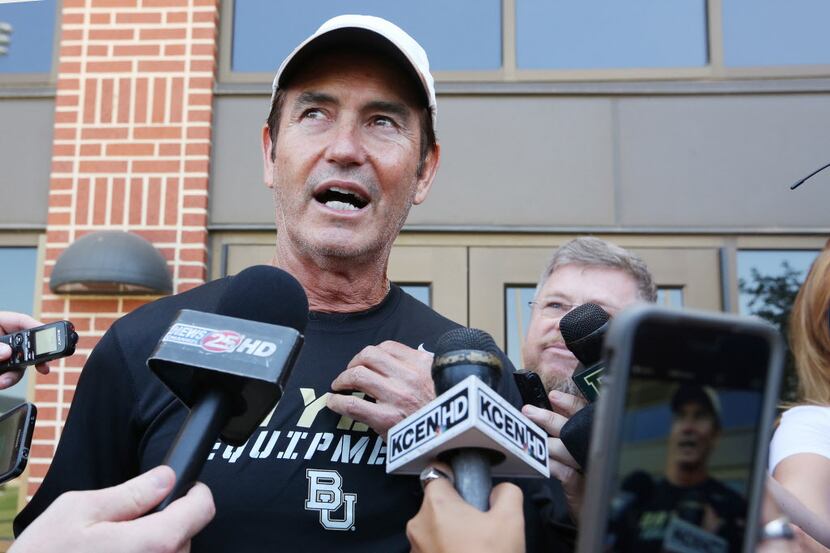 Baylor head football coach Art Briles talks with the media before the first day of practice...