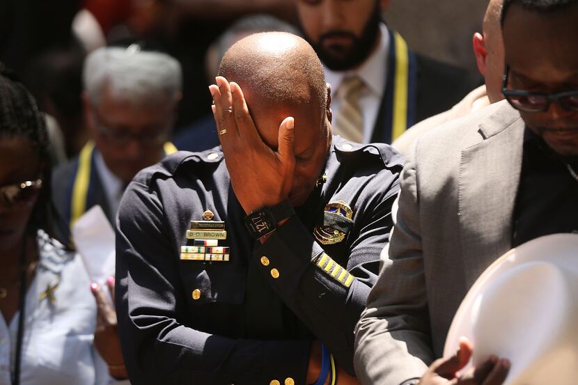 Dallas Police Chief David Brown pauses at a prayer vigil for the five slain officers. 