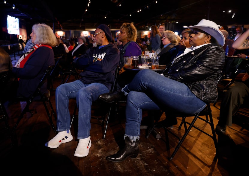 Democratic supporter Sharon Davis (right) and Vernell Franklin watch as former President...