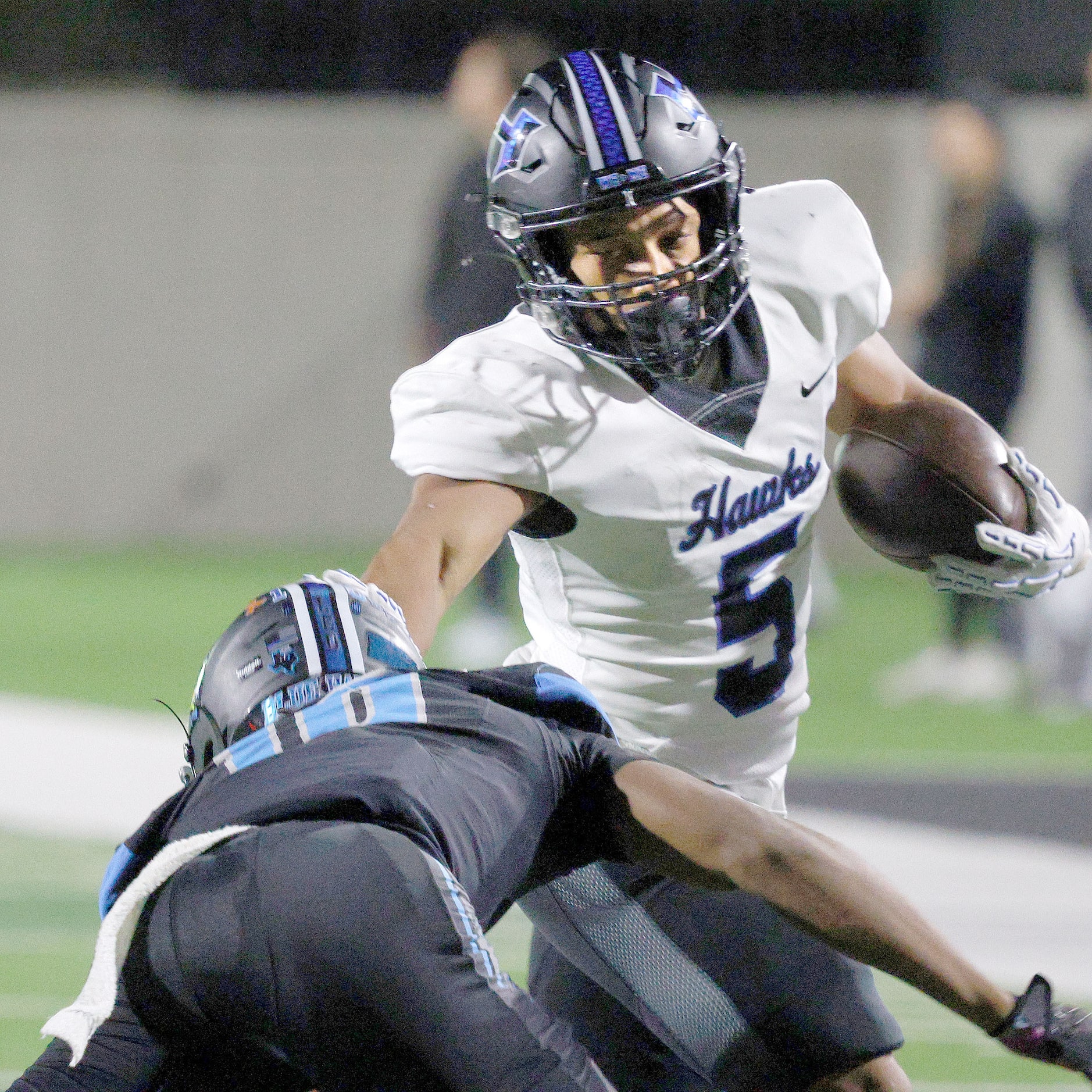 Hebron's Ayson McCray Jones (5) carries the ball as Rock Hill's Courtney Lawson (10) goes to...