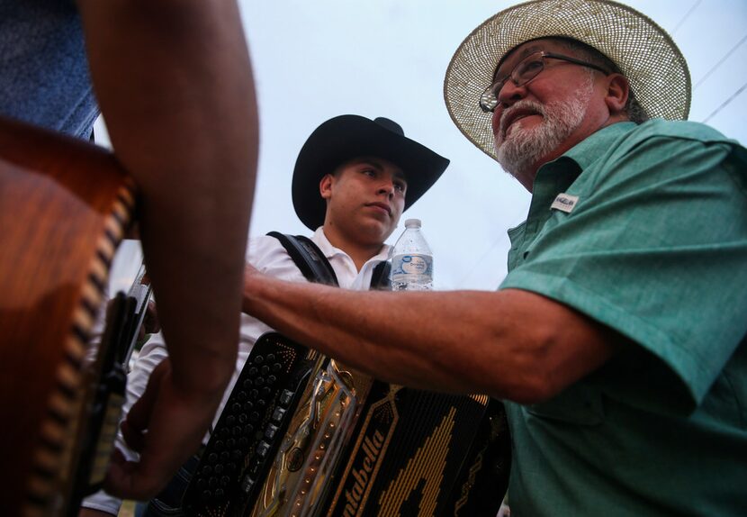 La Joya ISD music teacher Cecilio Garza speaks to his students before they perform during La...