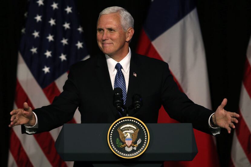In the file photo, Vice President Mike Pence gestures as he delivers a speech during a...