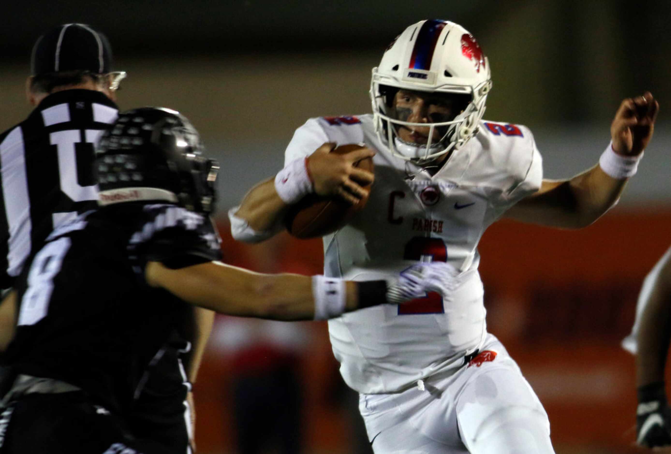 Parish Episcopal quarterback Preston Stone (2) cuts laterally to avoid the defensive pursuit...