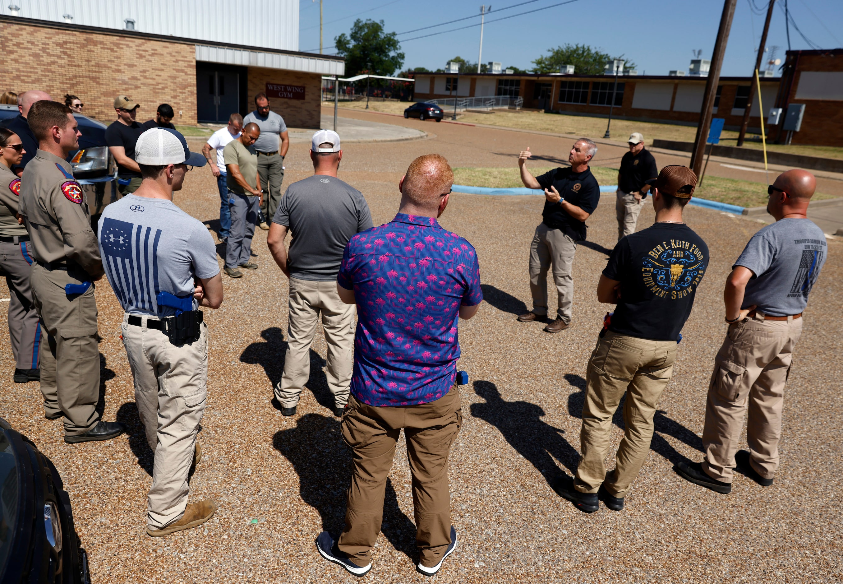 Advanced Law Enforcement Rapid Response Training instructor Troy Dupuy (with arms up)...