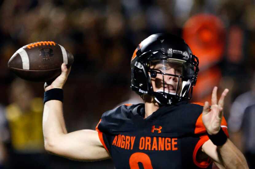 Rockwall High quarterback Braedyn Locke (8) throws a pass during the first half of their...