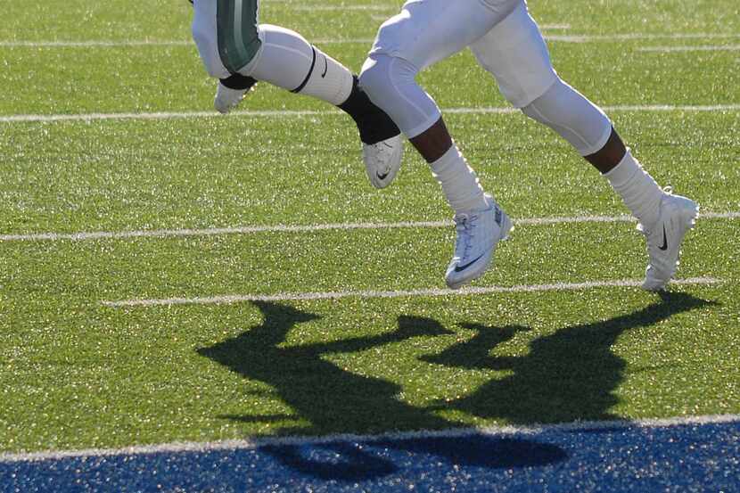 DeAndre McNeal goes up for a touchdown reception for Mesquite Poteet in the regional...