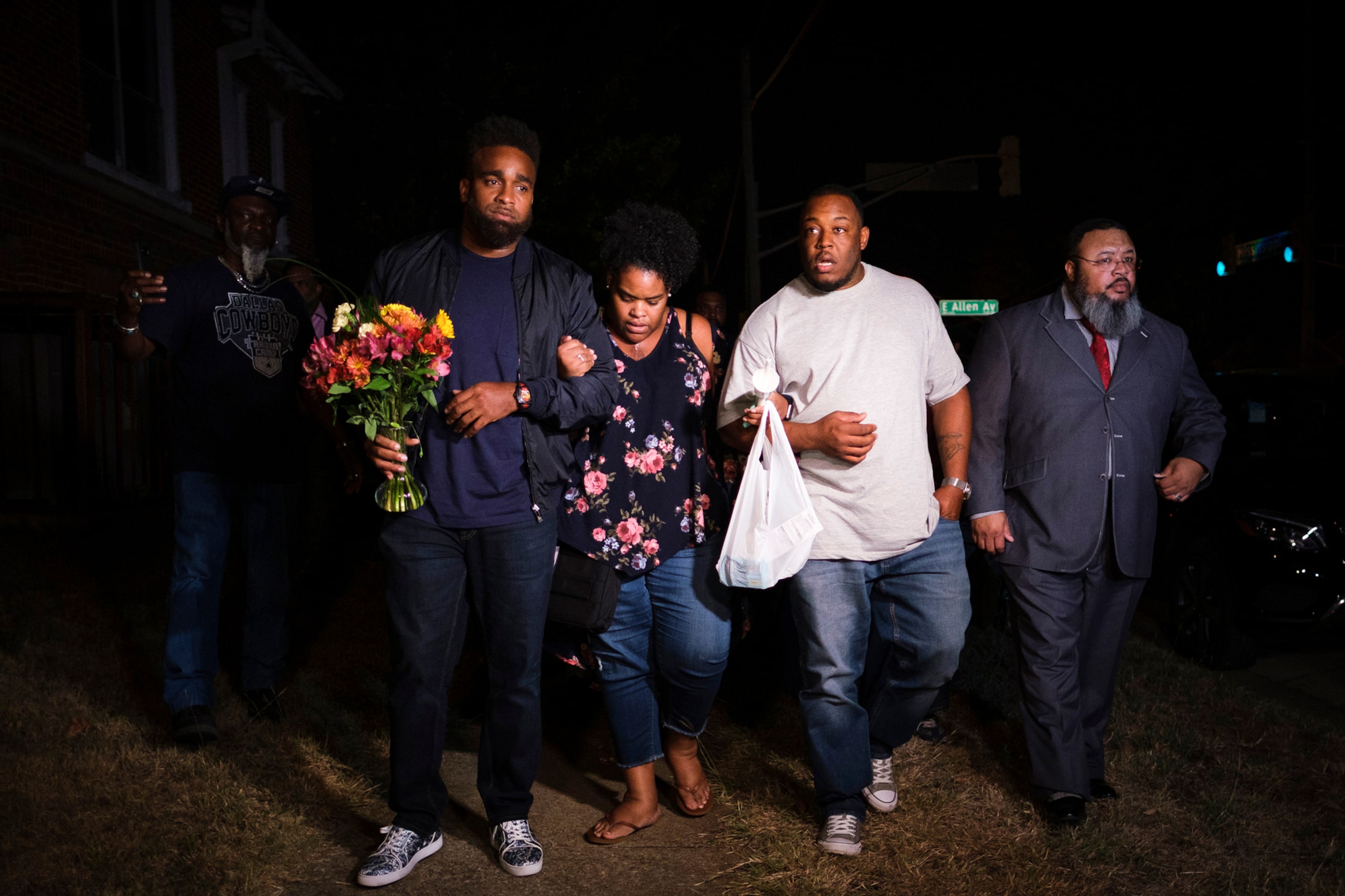 Members of the victimÕs family depart a community vigil for Atatiana Jefferson on Sunday,...