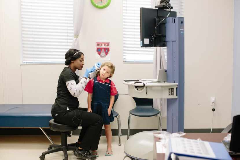 Melia Ackley-Kinder, a student at Uplift Peak Preparatory in Dallas, has a virtual doctor s...