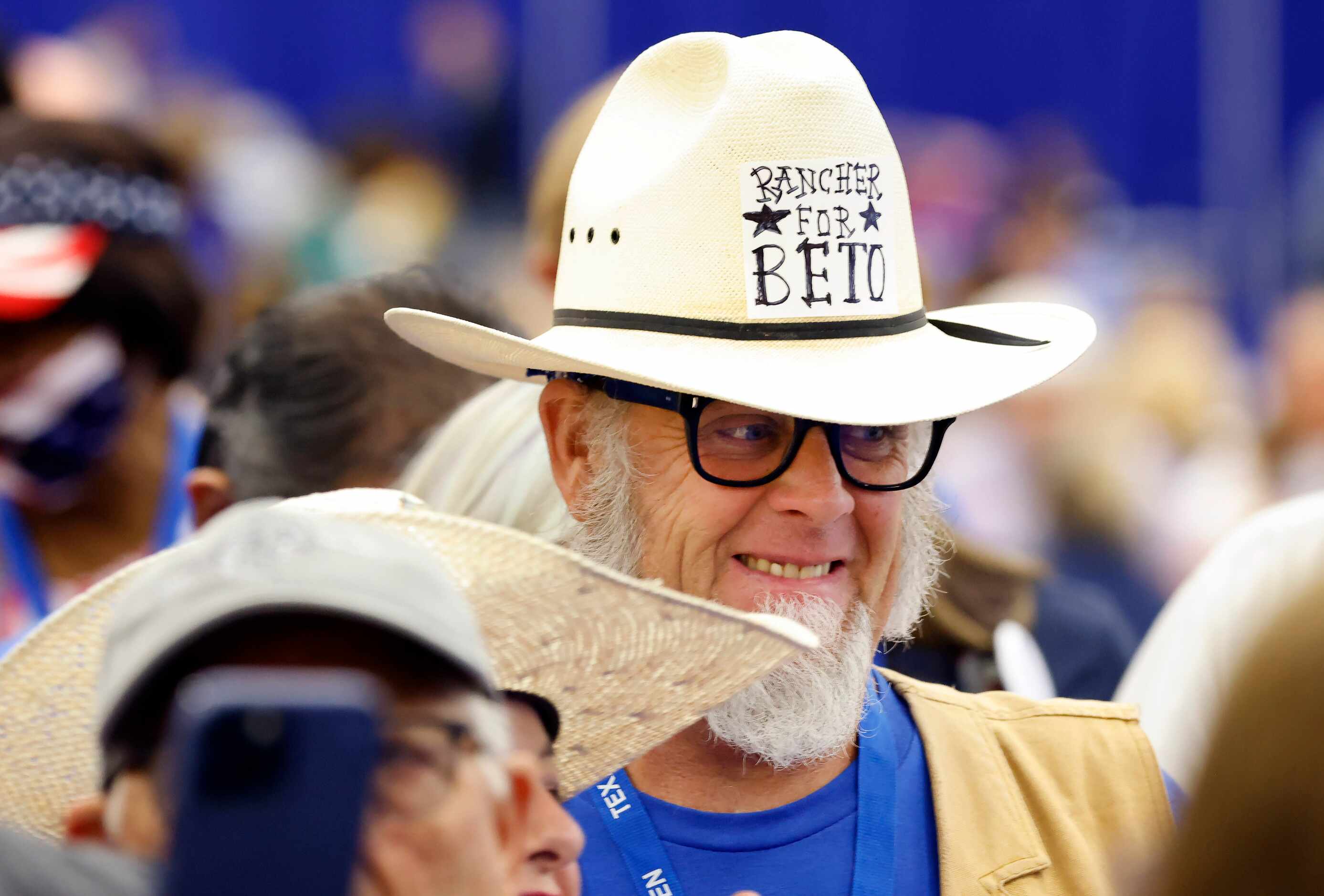 Wearing a Ranchers for Beto cowboy hat, Andy Don Emmons of Waxahachie, Texas waits in line...
