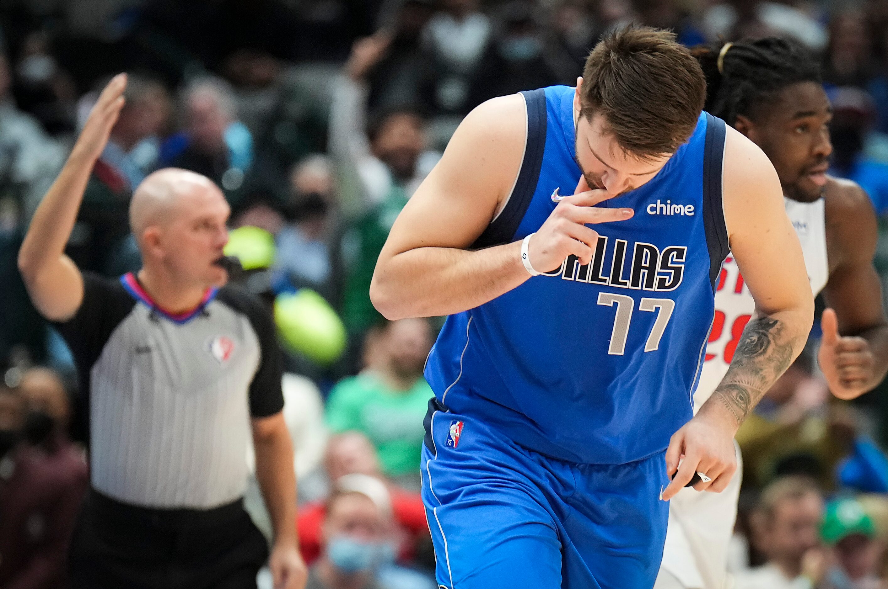 Dallas Mavericks guard Luka Doncic (77) celebrates after hitting a 3-pointer past Detroit...