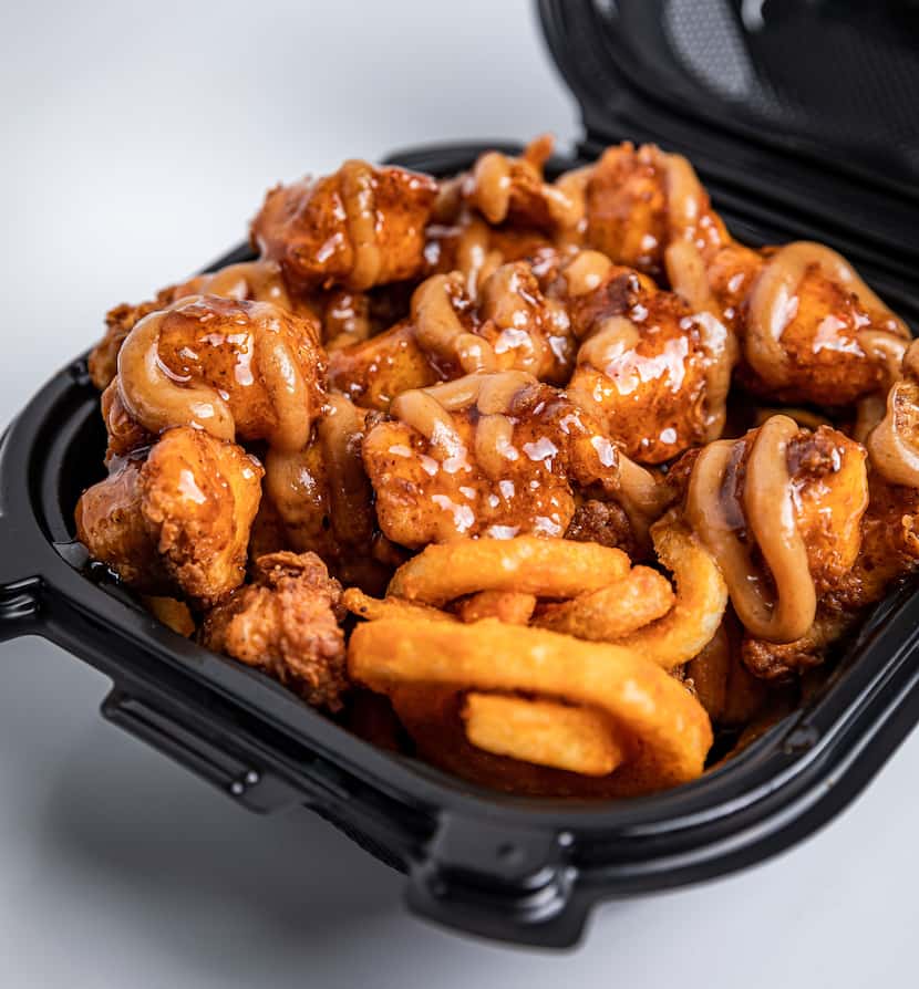 Bad Chicken's nuggets come in "chicken bomb bowls," served on a bed of curly fries. 