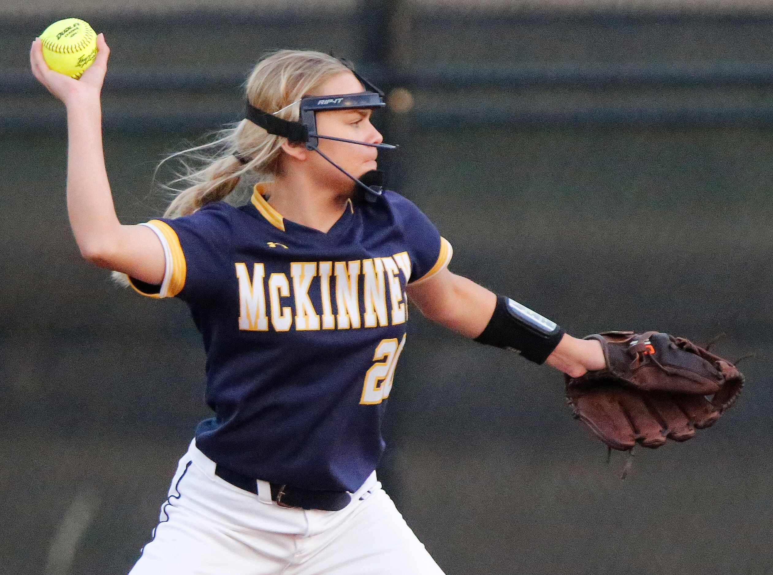 McKinney High School second baseman Zoe Thornburg (20) makes a throw in the first inning as...