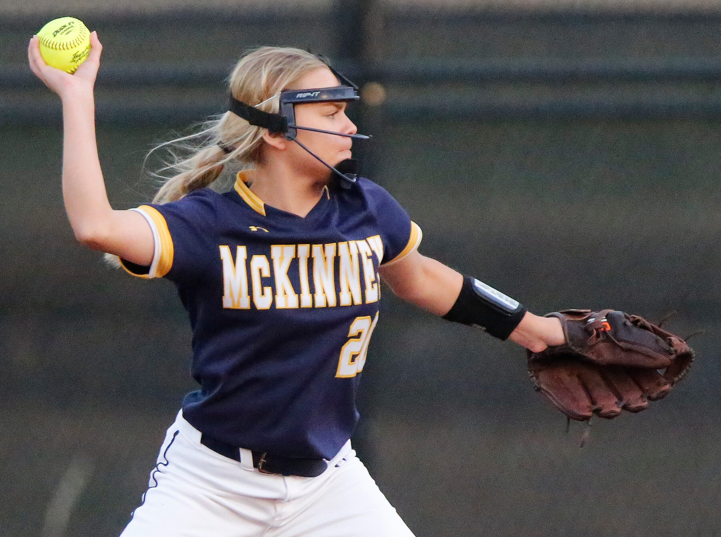 McKinney High School second baseman Zoe Thornburg (20) makes a throw in the first inning as...