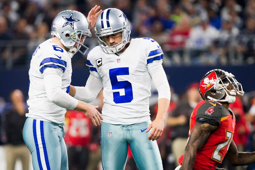 Dallas Cowboys kicker Dan Bailey (5) celebrates with punter Chris Jones (6) after connecting...