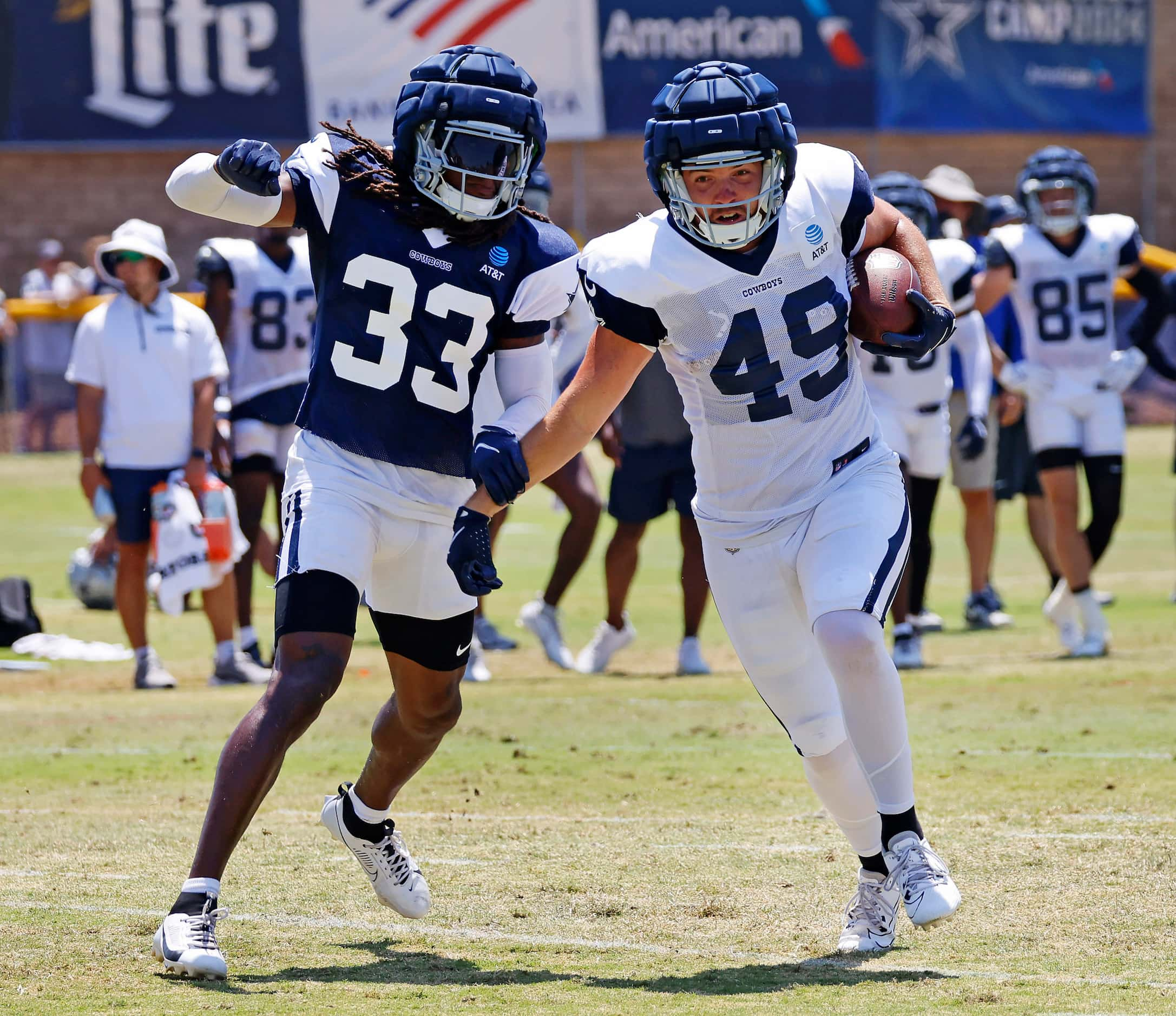 Dallas Cowboys tight end Alec Holler (49) breaks away from safety Julius Wood (33) after...