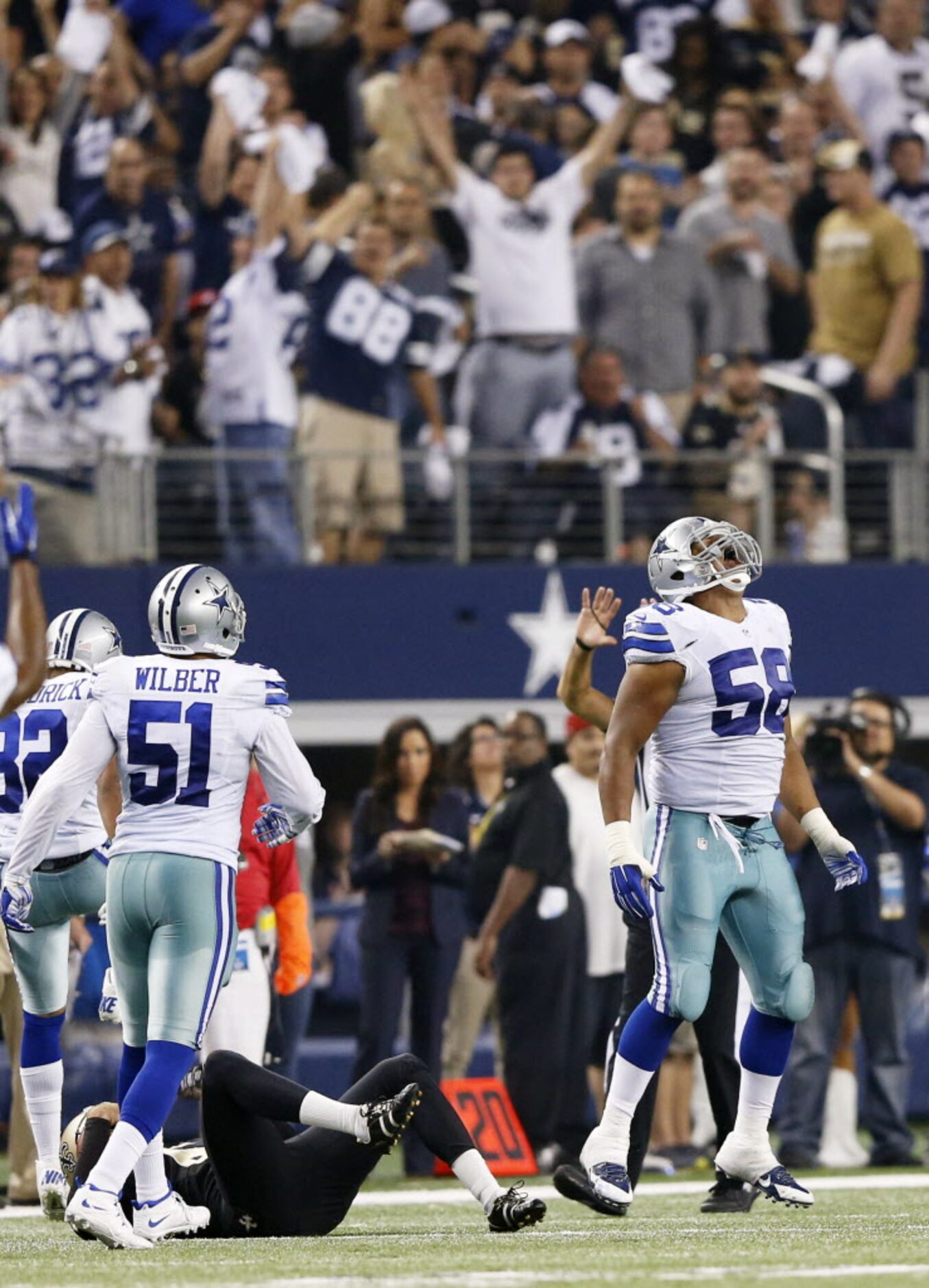 Dallas Cowboys defensive end Jack Crawford (58) celebrates after stopping a fourth down...