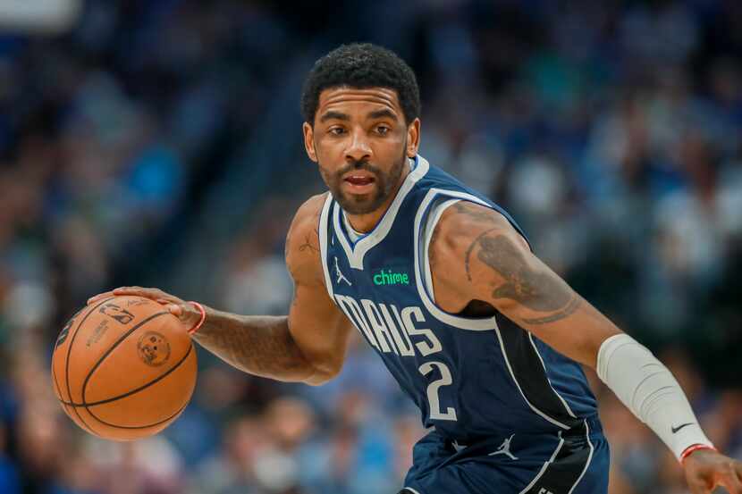 Dallas Mavericks guard Kyrie Irving looks to drive to the basket during the first half of an...