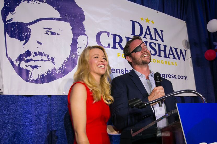  Republican congressional candidate Dan Crenshaw, with his wife, Tara, delivered a victory...