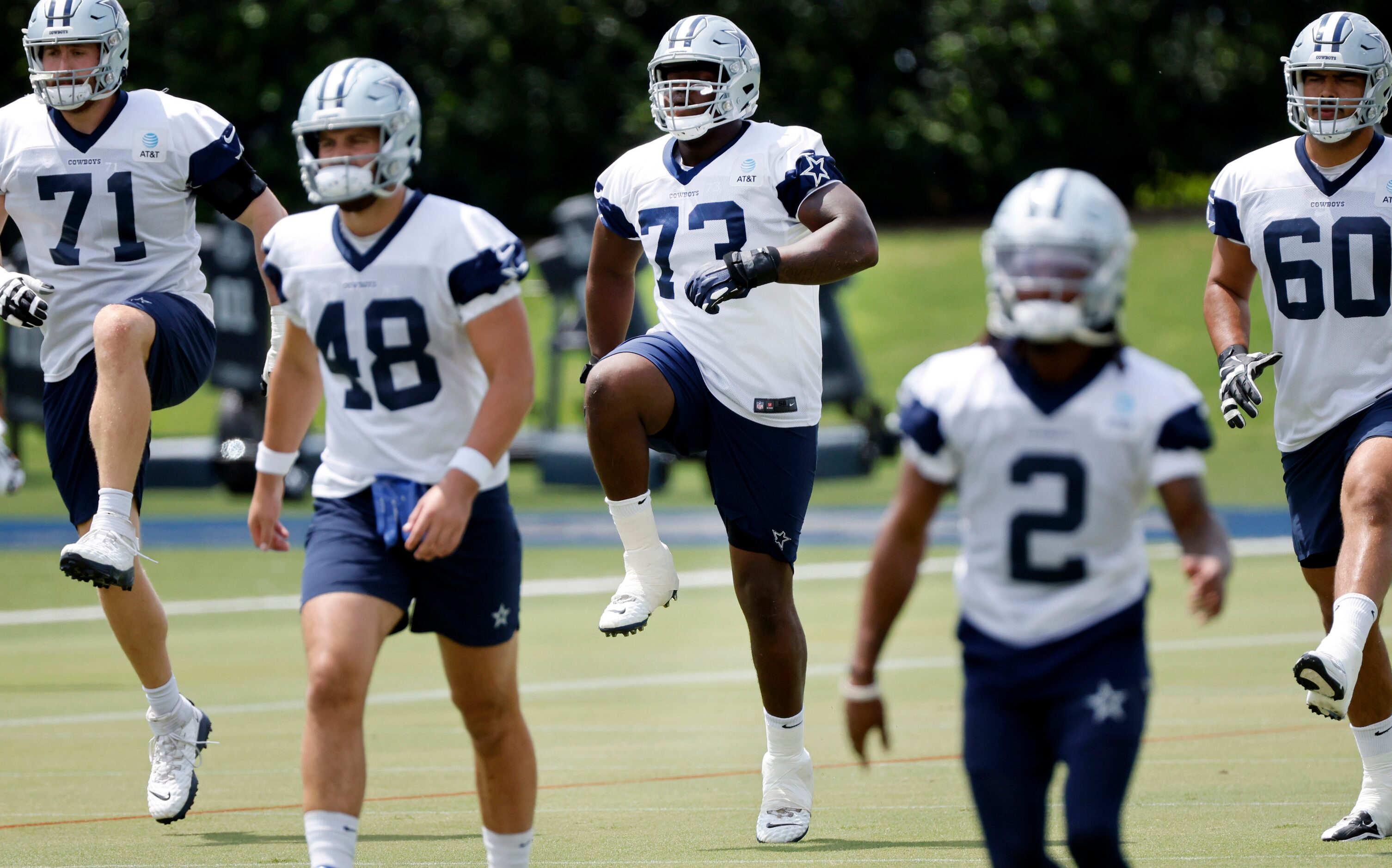 Dallas Cowboys offensive tackle Tyler Smith (73) runs through drills with the offense during...