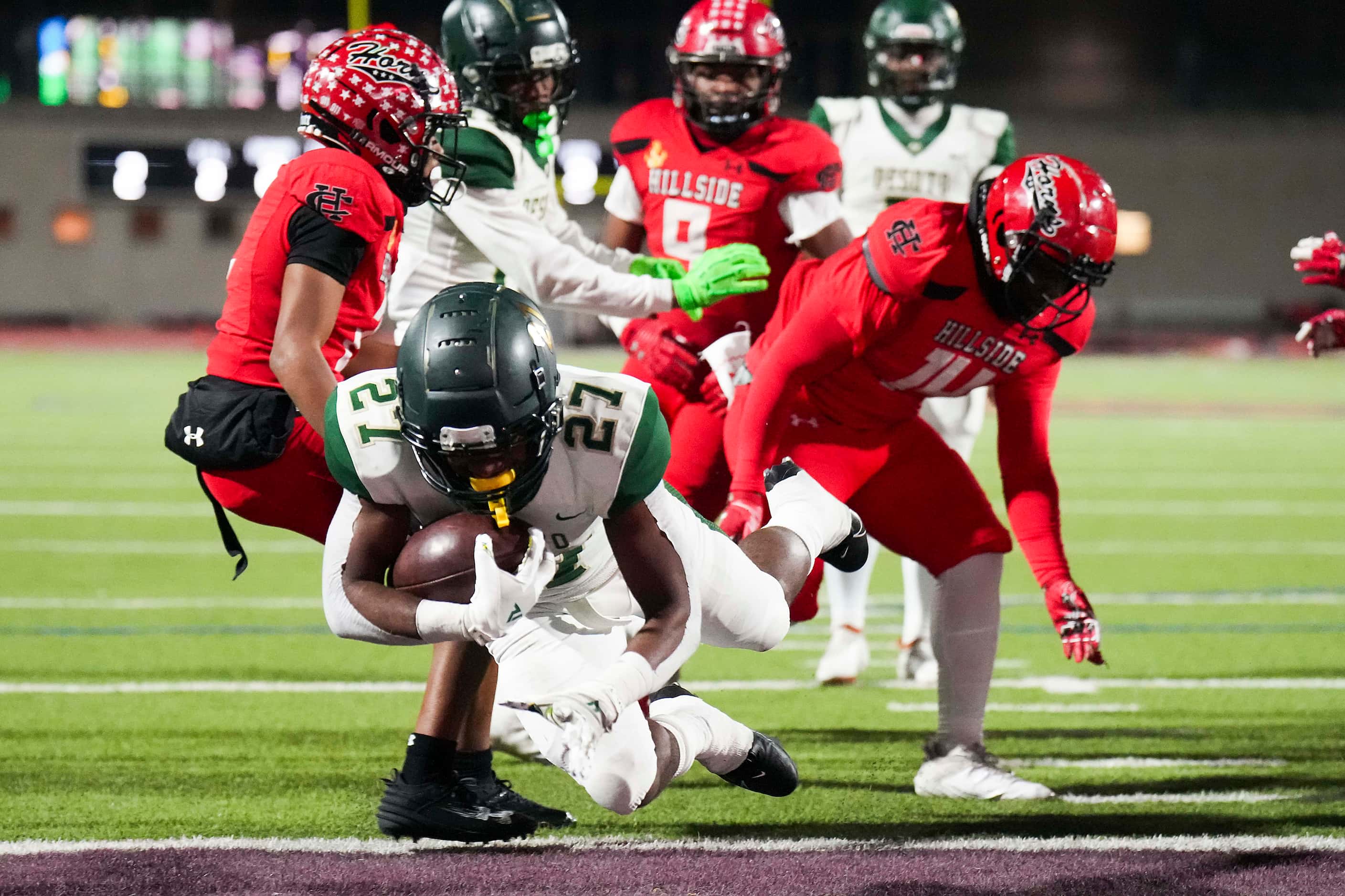 DeSoto running back Marvin Duffey (27) dives into the end zone for a touchdown during the...