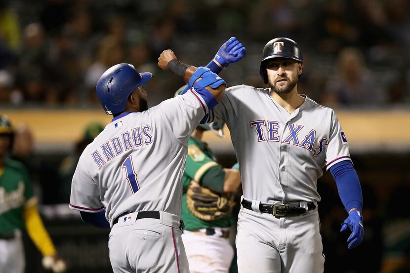 OAKLAND, CA - SEPTEMBER 07:  Joey Gallo #13 of the Texas Rangers is congratulated by Elvis...