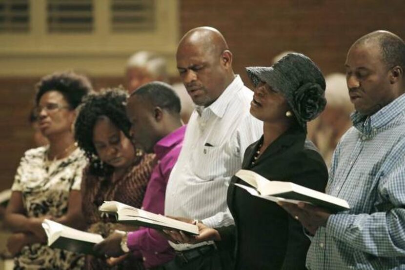 
Members of the Dallas-area Liberian community sang at a memorial service for Thomas Duncan...