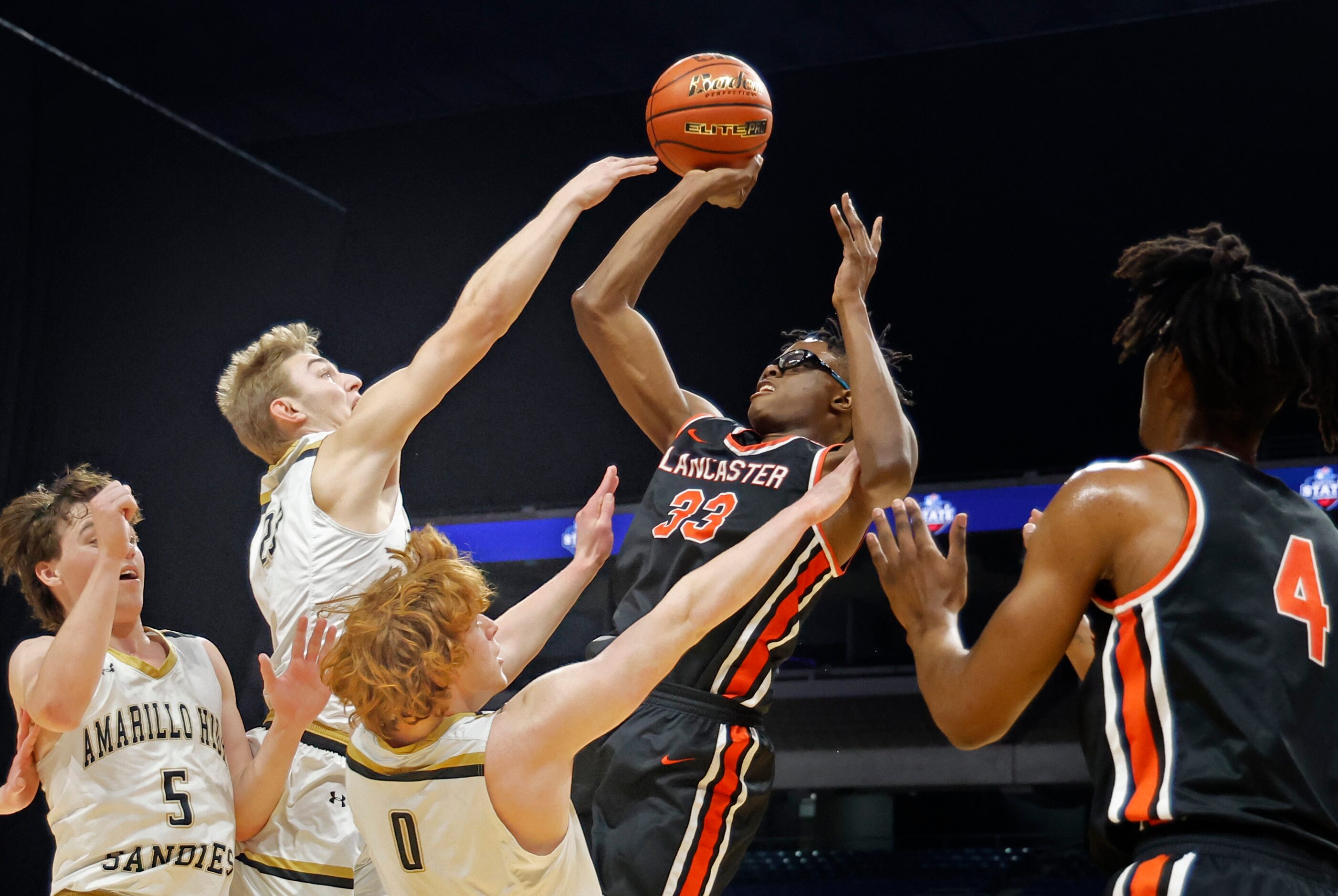 Lancaster Tigers Amari Reed (33) shots over Amarillo Golden Sandstorm TJ Brown (23) In the...