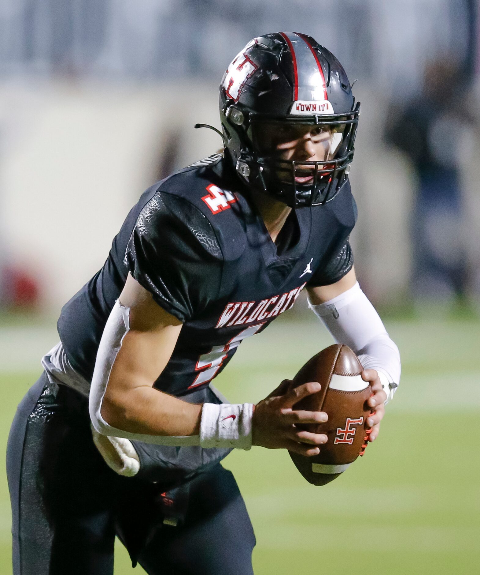 Lake Highlands senior quarterback Caden Dotson (4) looks for an open receiver during the...