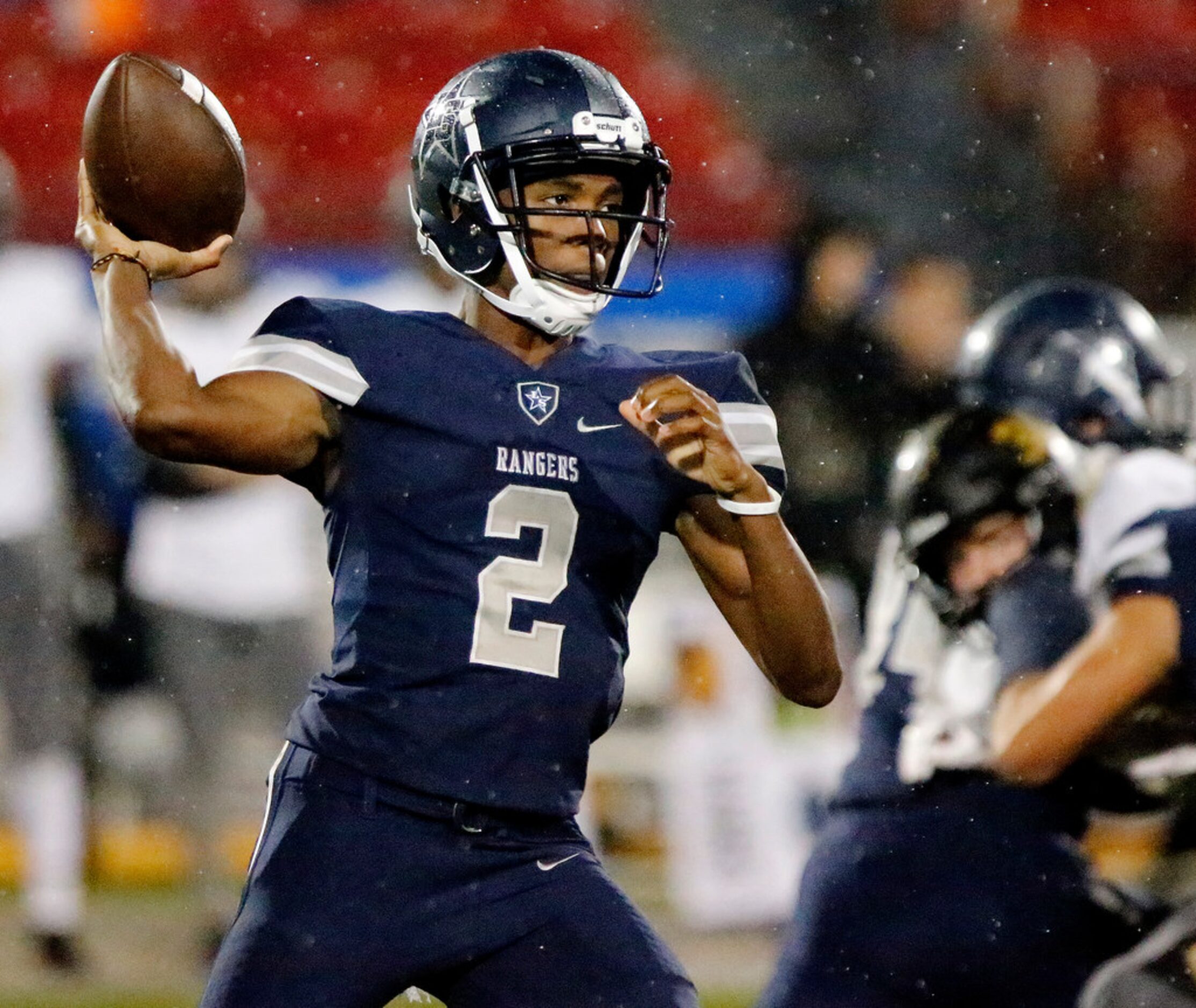 Lone Star High School quarterback Julian Larry (2) throws a pass during the first half as...