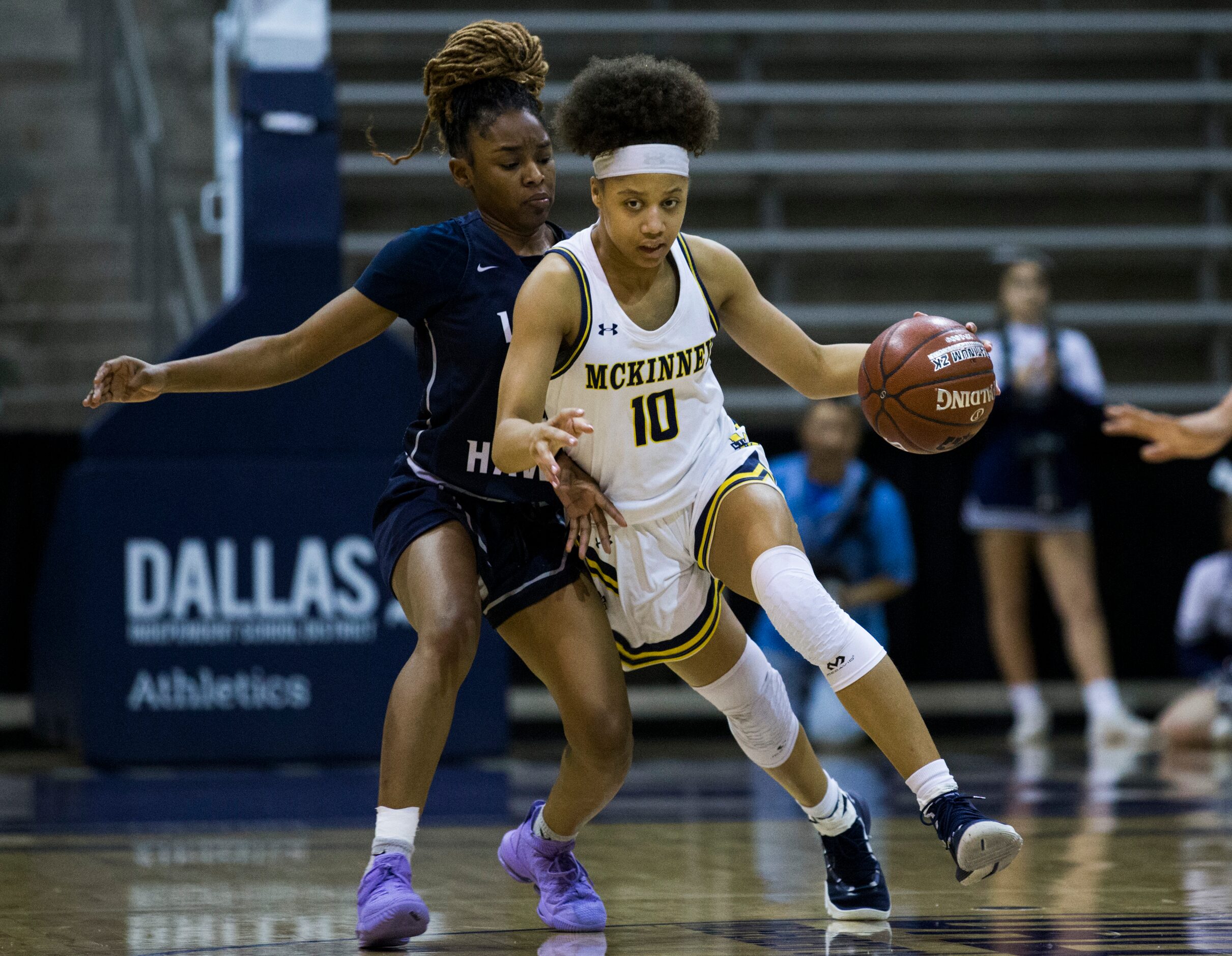 McKinney guard Erin Fry (10) pushes against Pflugerville Hendrickson guard Amahjia Lovings...