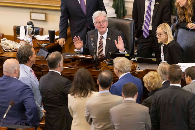 Texas Lt. Gov. Dan Patrick talks to the defense and prosecution attorneys after the defense...