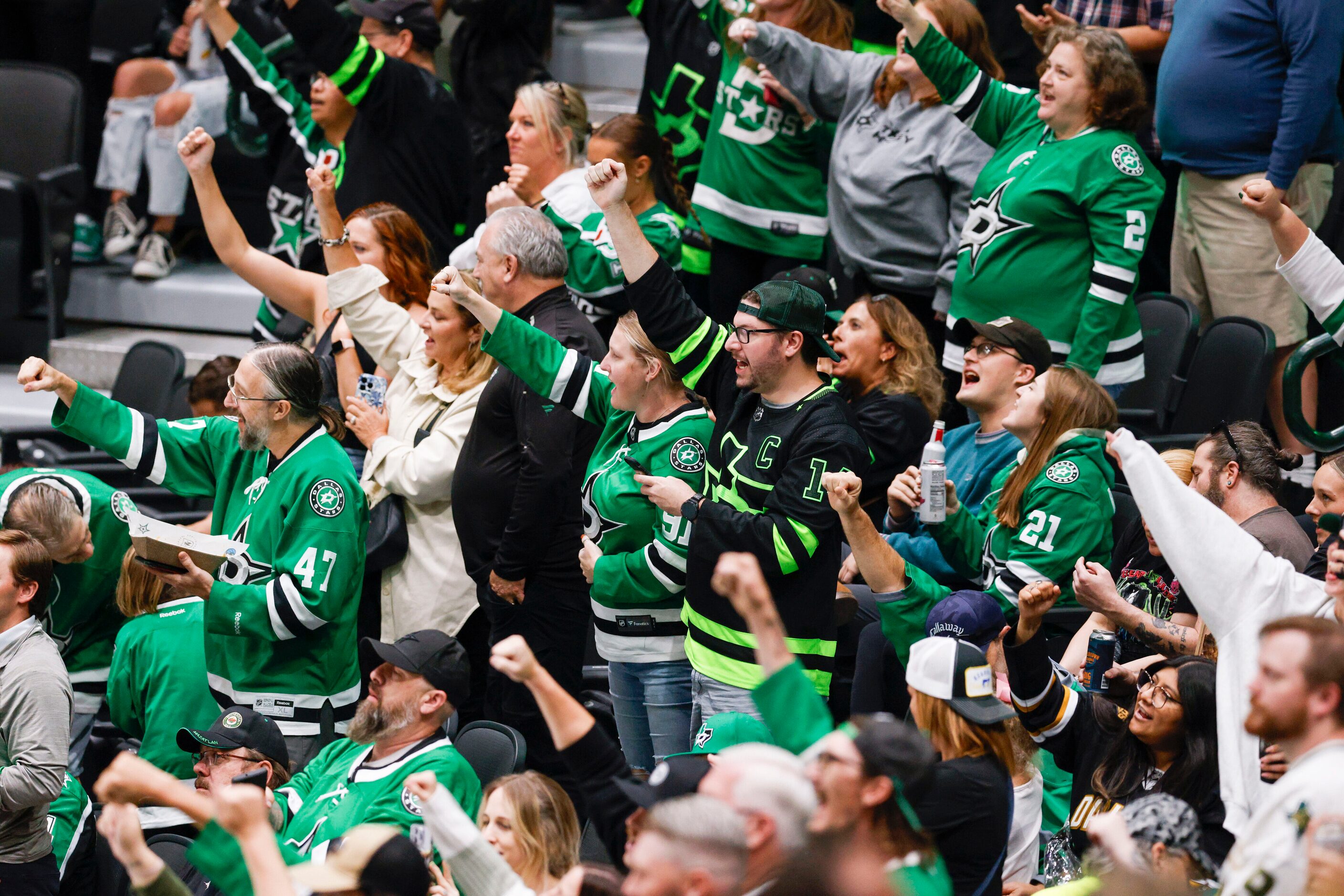 Dallas Stars fans celebrate a goal by left wing Jason Robertson (21) during the second...