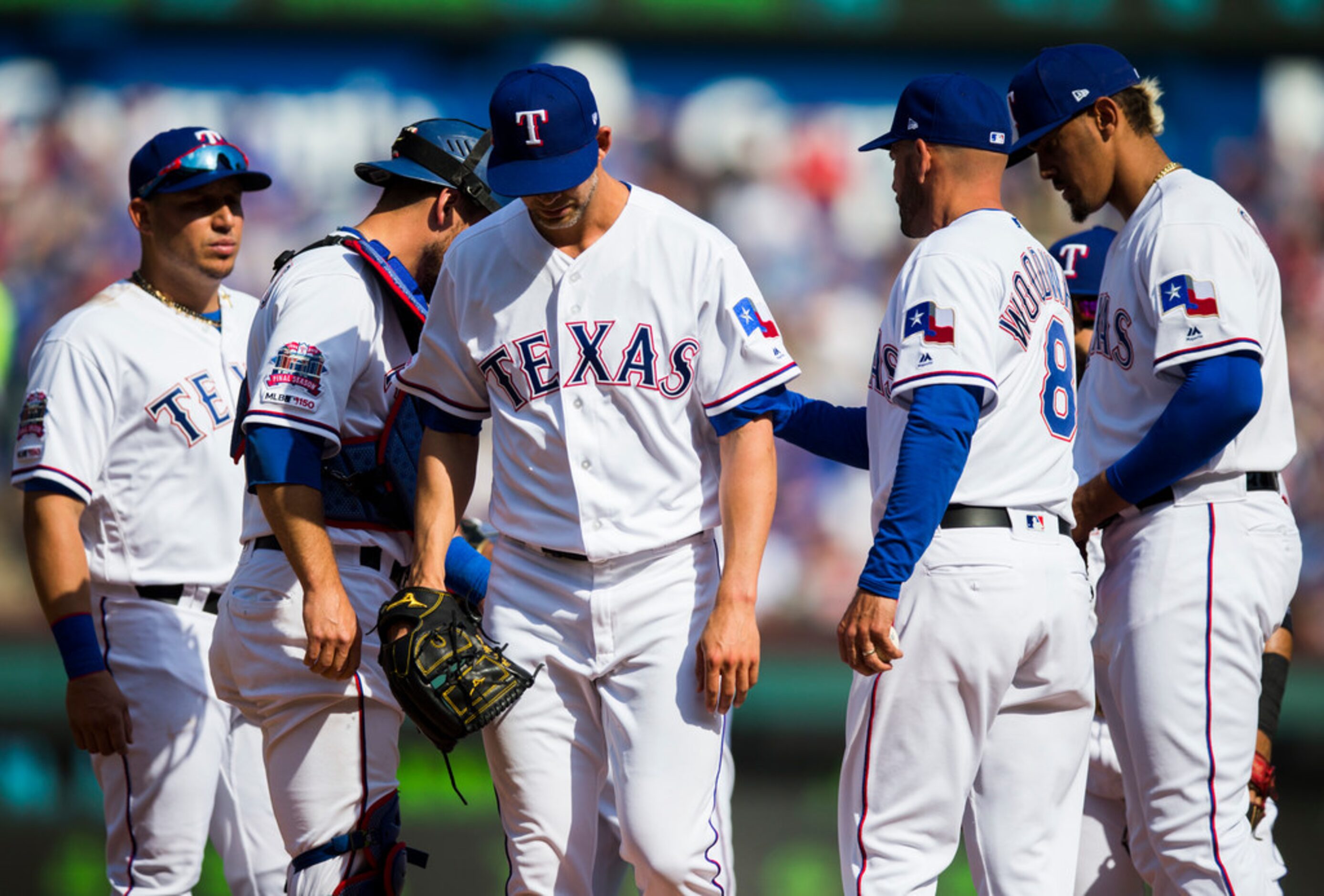 Texas Rangers starting pitcher Mike Minor (23) leaves the mound during the fifth inning of...