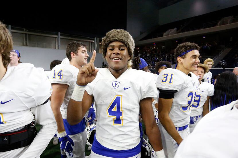 Frisco's Chase Lowery (4), clad in a raccoon skin cap, celebrates his team's 18-0 win over...