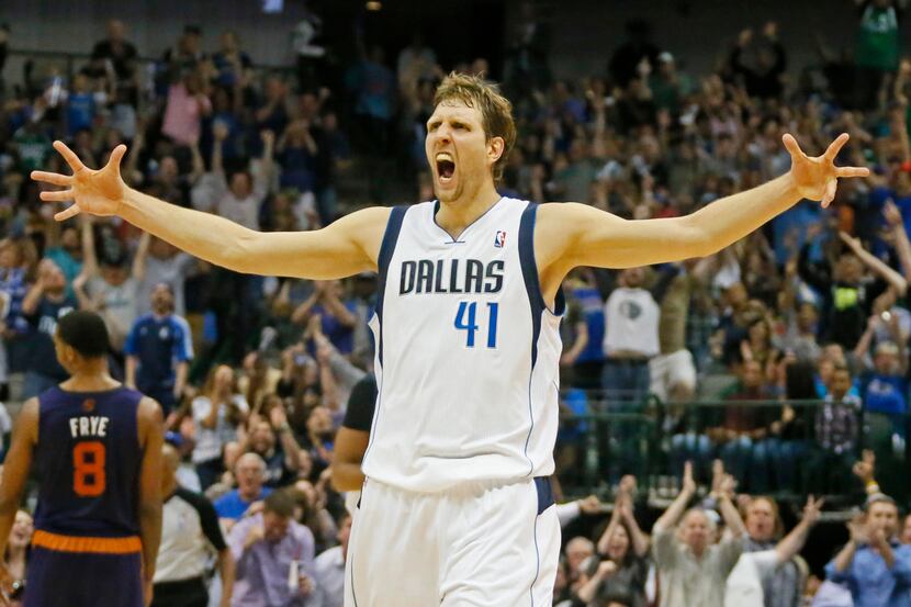 Dallas' Dirk Nowitzki gets pumped up as the Mavs mount a comeback in the fourth quarter to...