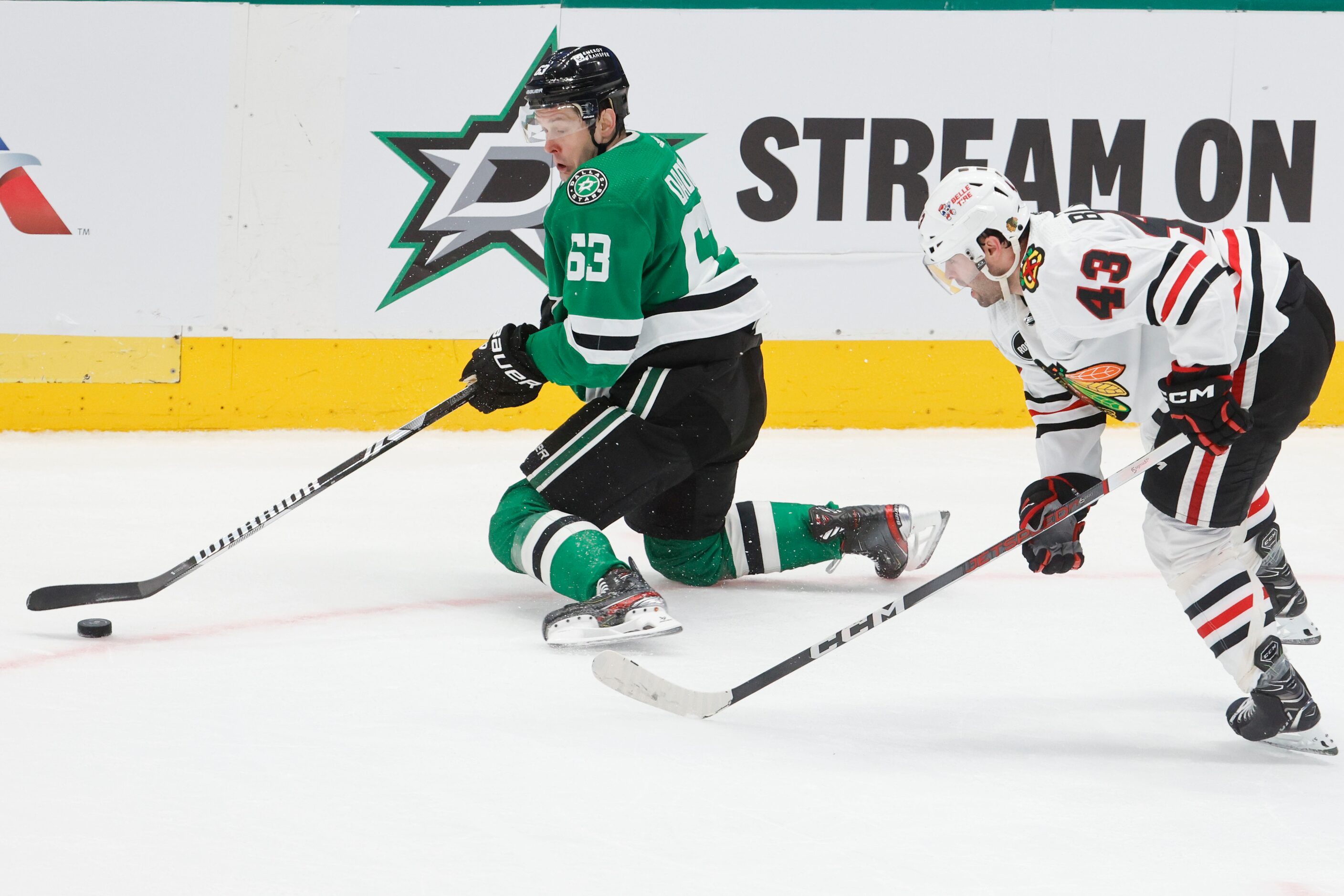 Dallas Stars right wing Evgenii Dadonov (63) controls the puck against Chicago Blackhawks...