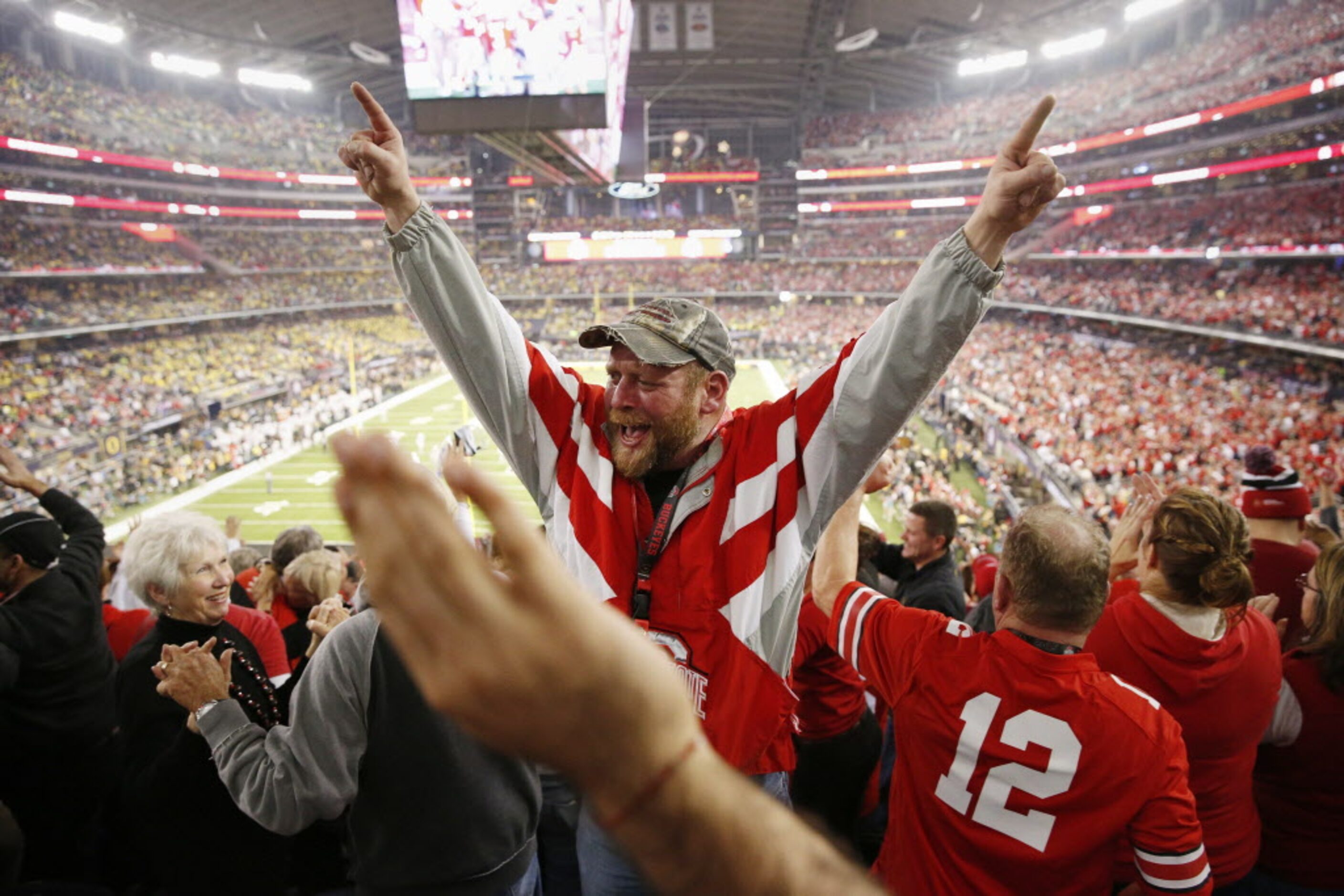 Ohio State Buckeyes fan Sean Bogan, of Pataskala, Ohio, celebrates after Ohio State stopped...