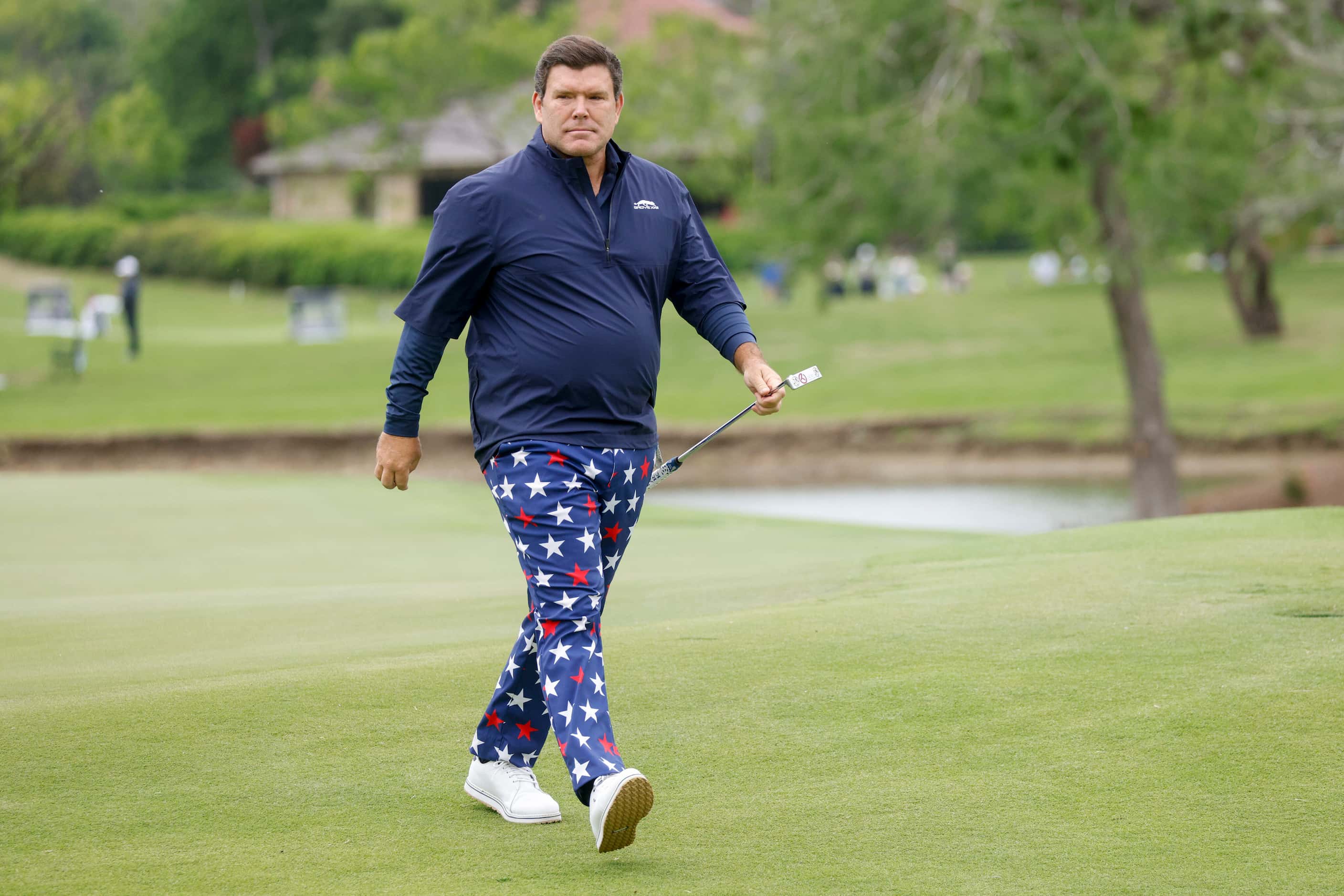 Fox News anchor Bret Baier walks off the 18th green after the first round of the Invited...