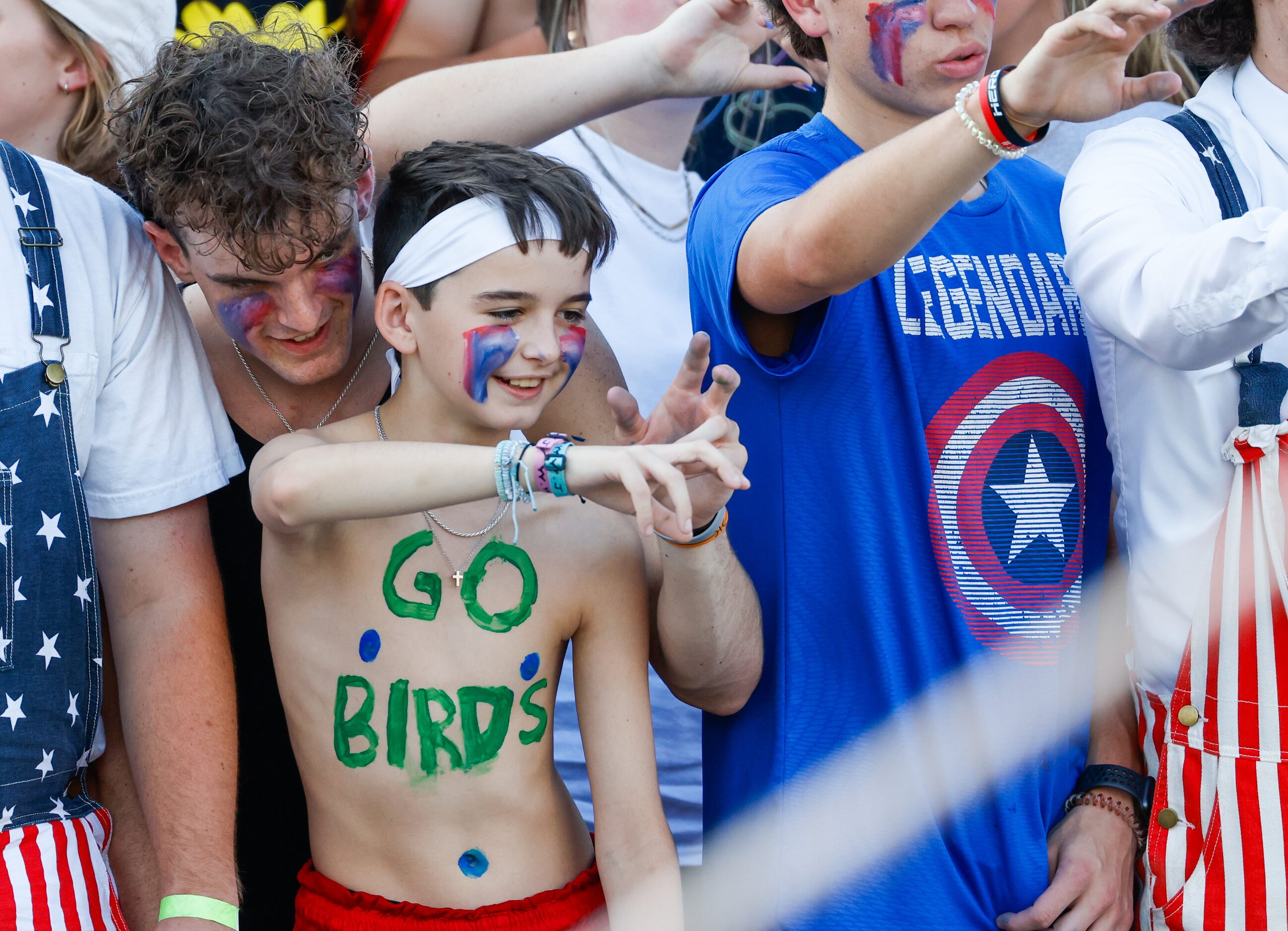 V.R. Eaton High School fans sing along with the school fight song before the school’s...