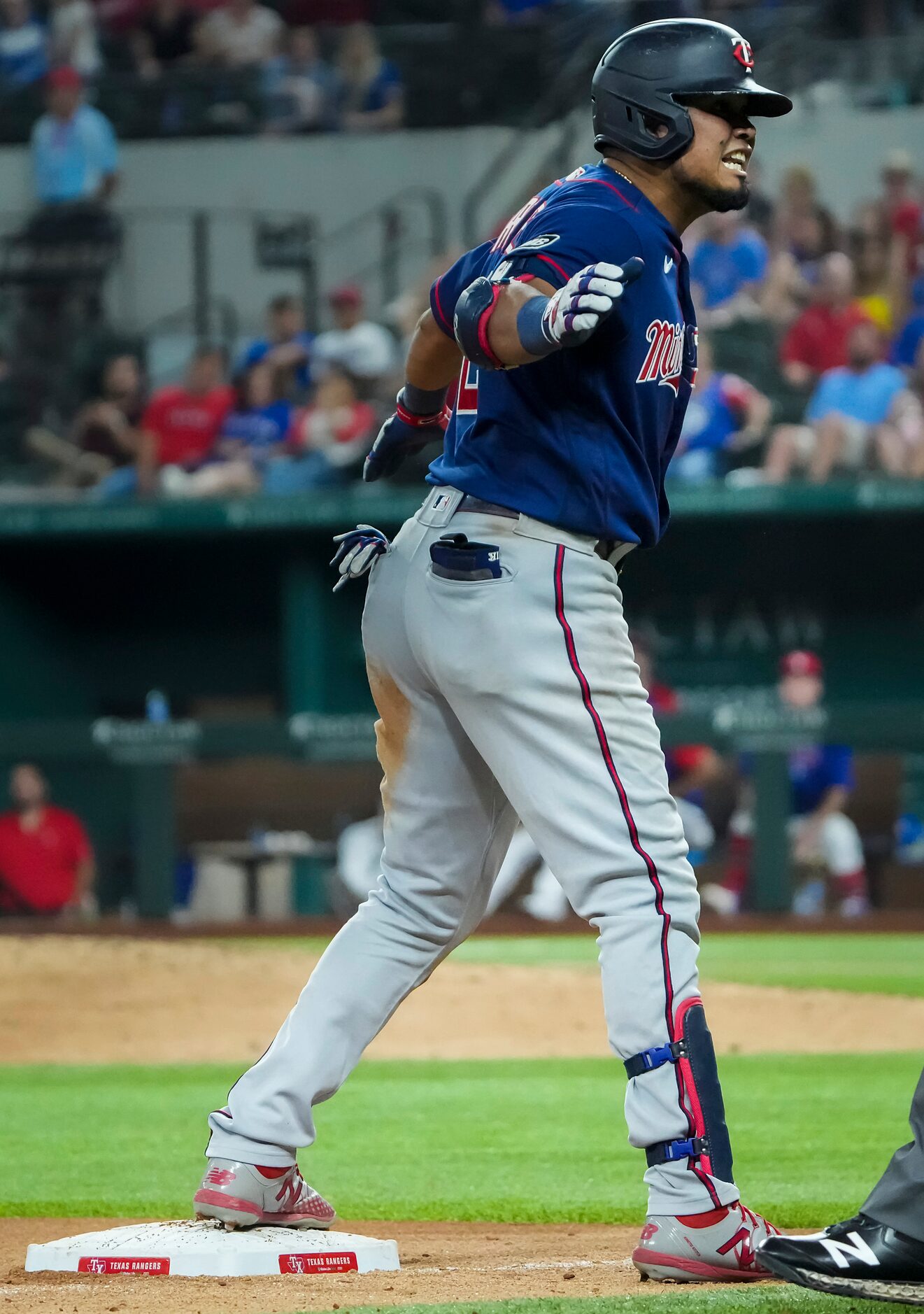 Minnesota Twins second baseman Luis Arraez celebrates after driving in a run with a triple...