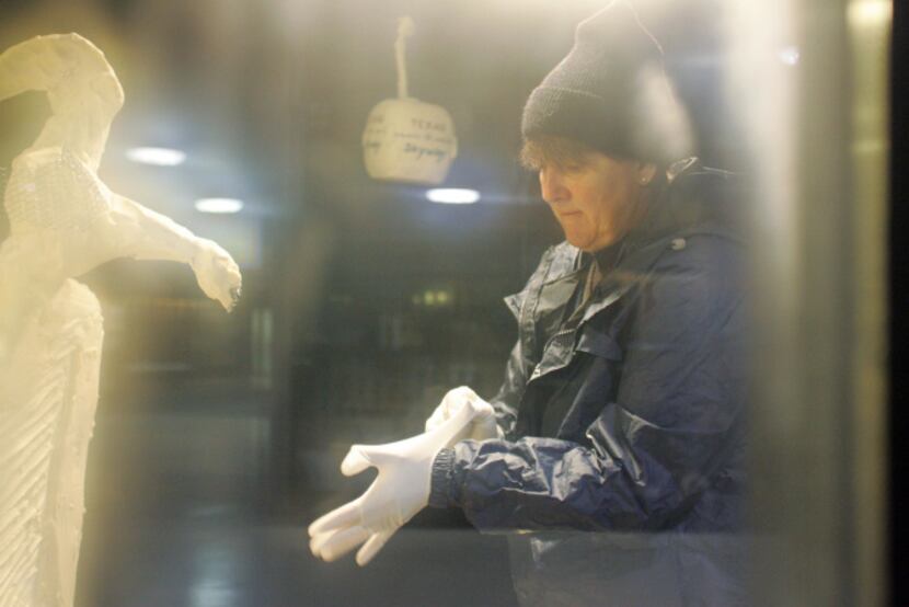 Condensation forms on the refrigeration case as professional sculptor Sharon BuMann prepares...